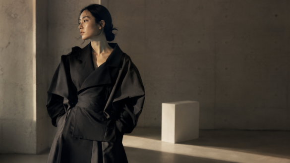 Korean fashion editorial — avant-garde hanbok-inspired silhouette in Seoul gallery interior, afternoon light